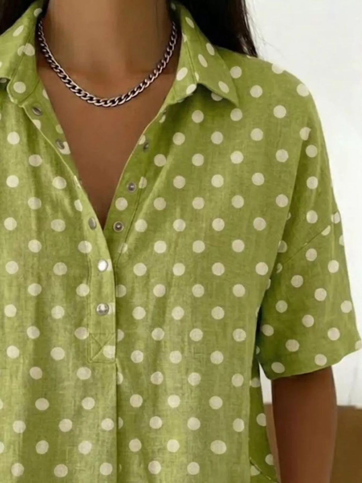 Plus size polka dot short sleeve shirt from Trendsi, full-size women's top with a classic polka dot pattern and comfortable fit.