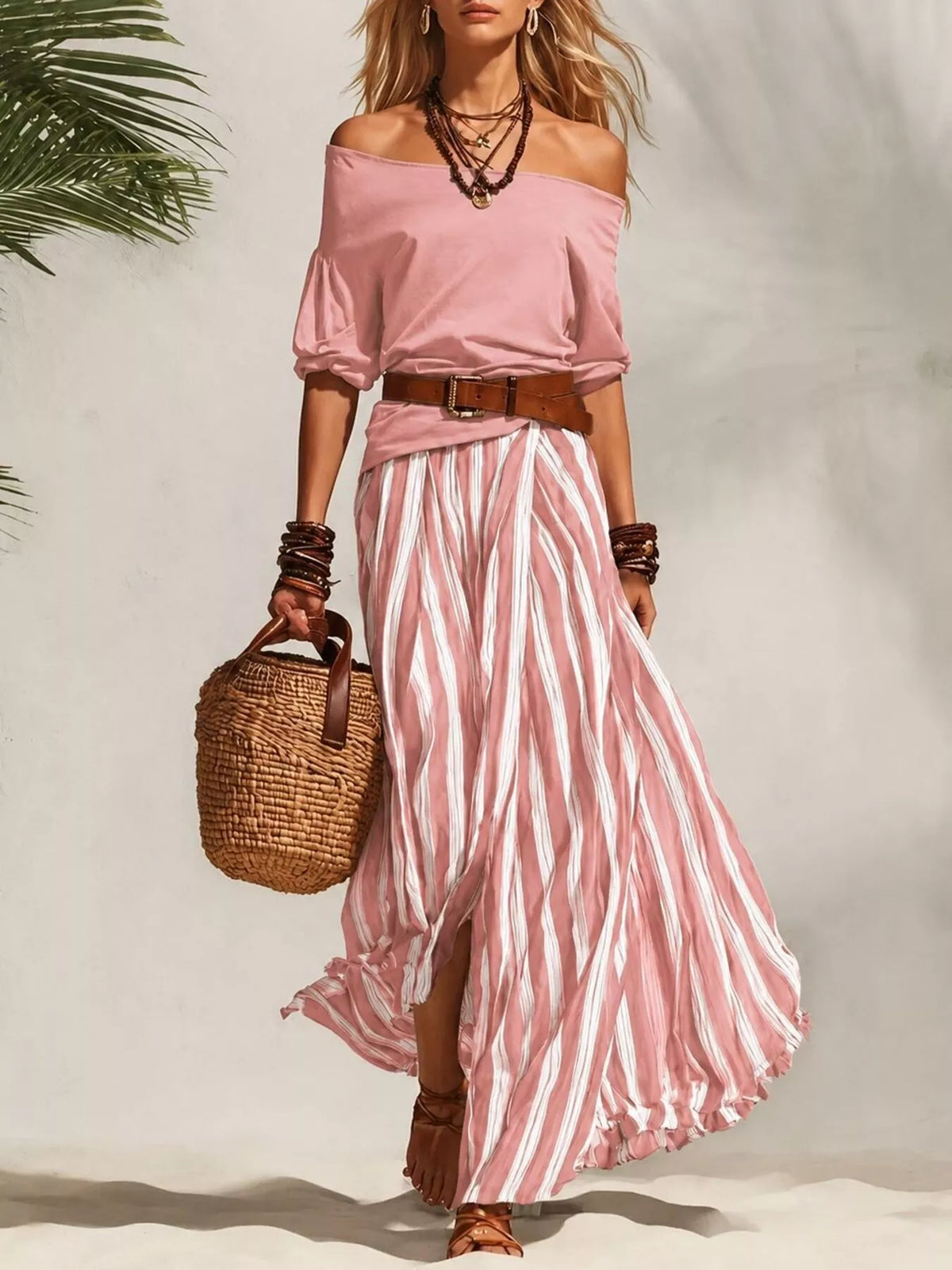 Off-shoulder top and striped maxi skirt matching set by Plush Fashion Hub, displayed on a hanger with a plain background.