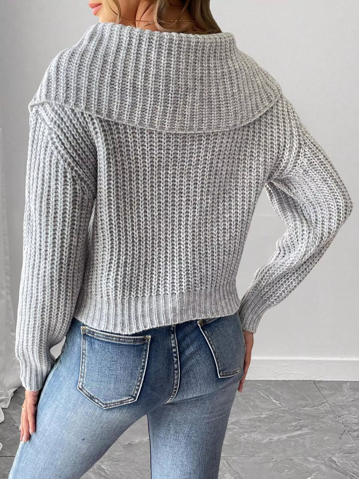 Contrast Bow Long Sleeve Sweater paired with a skirt, showcasing the stylish design and soft fabric from Trendsi.