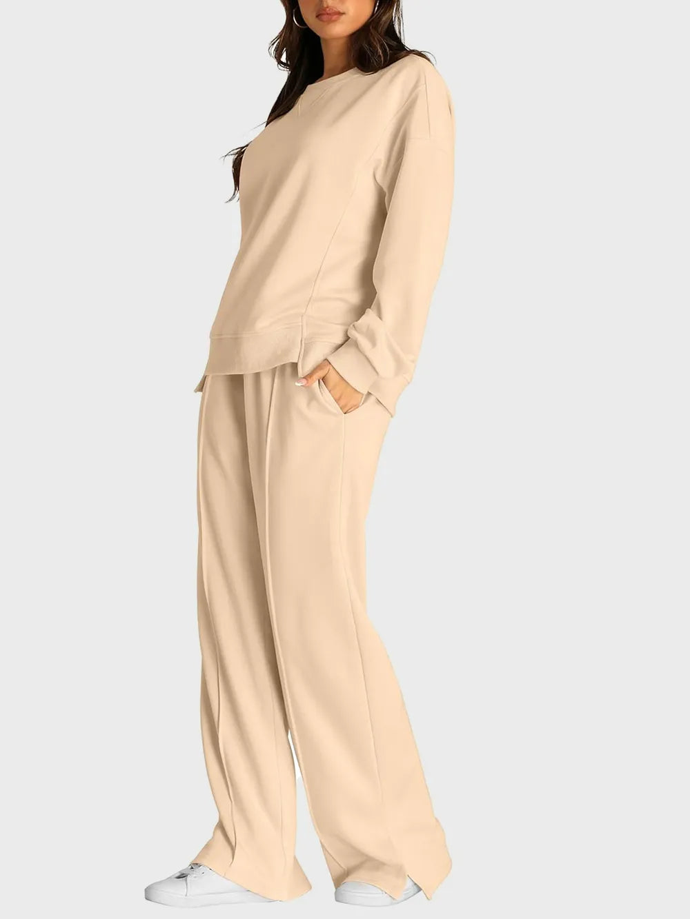Trendsi round neck long sleeve top with matching slit pants set, stylish and comfortable for casual wear.