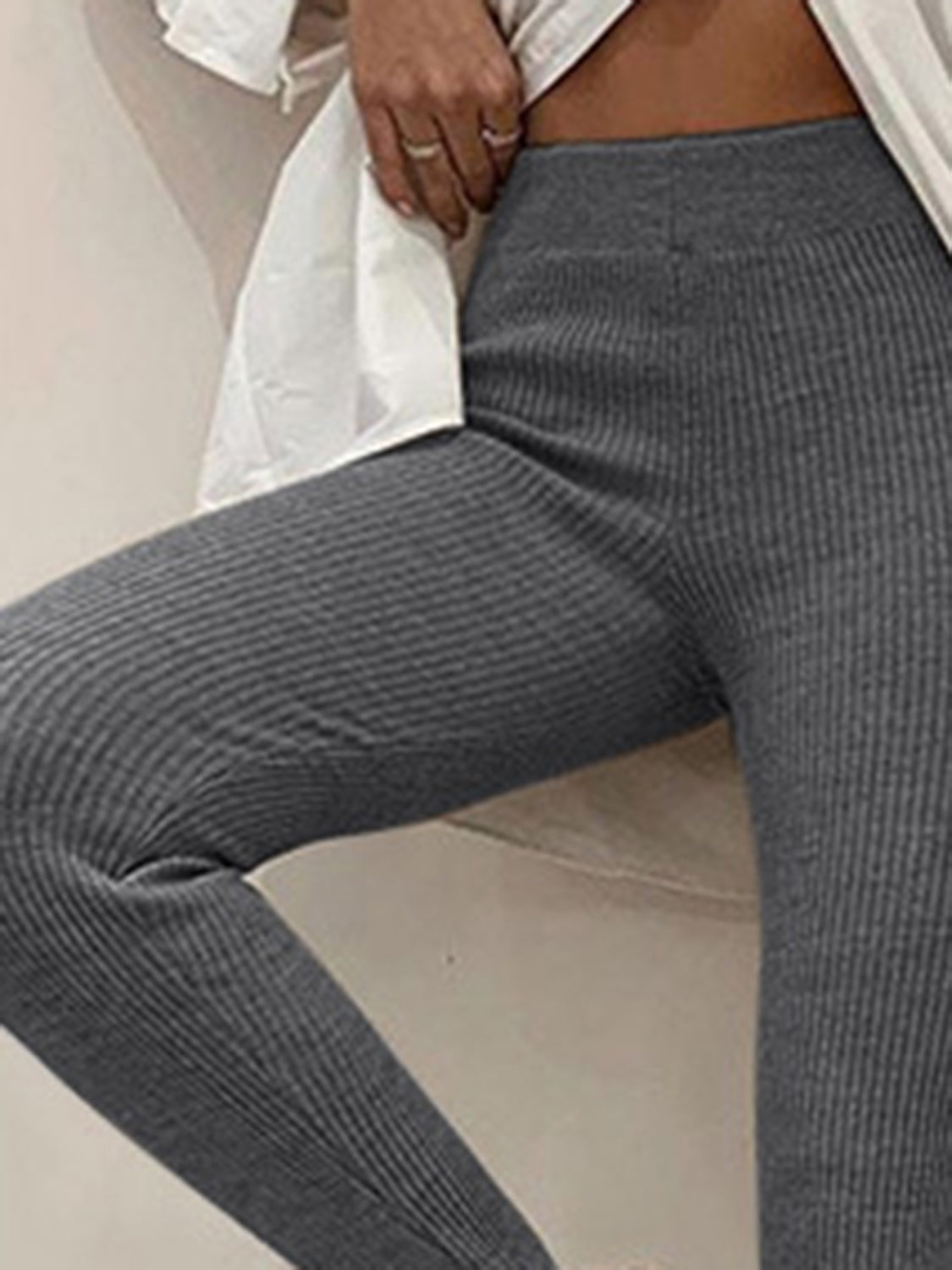 Plush Fashion Hub ribbed mid-waist leggings in soft fabric, showing the fitted design and ribbed texture on a neutral background.