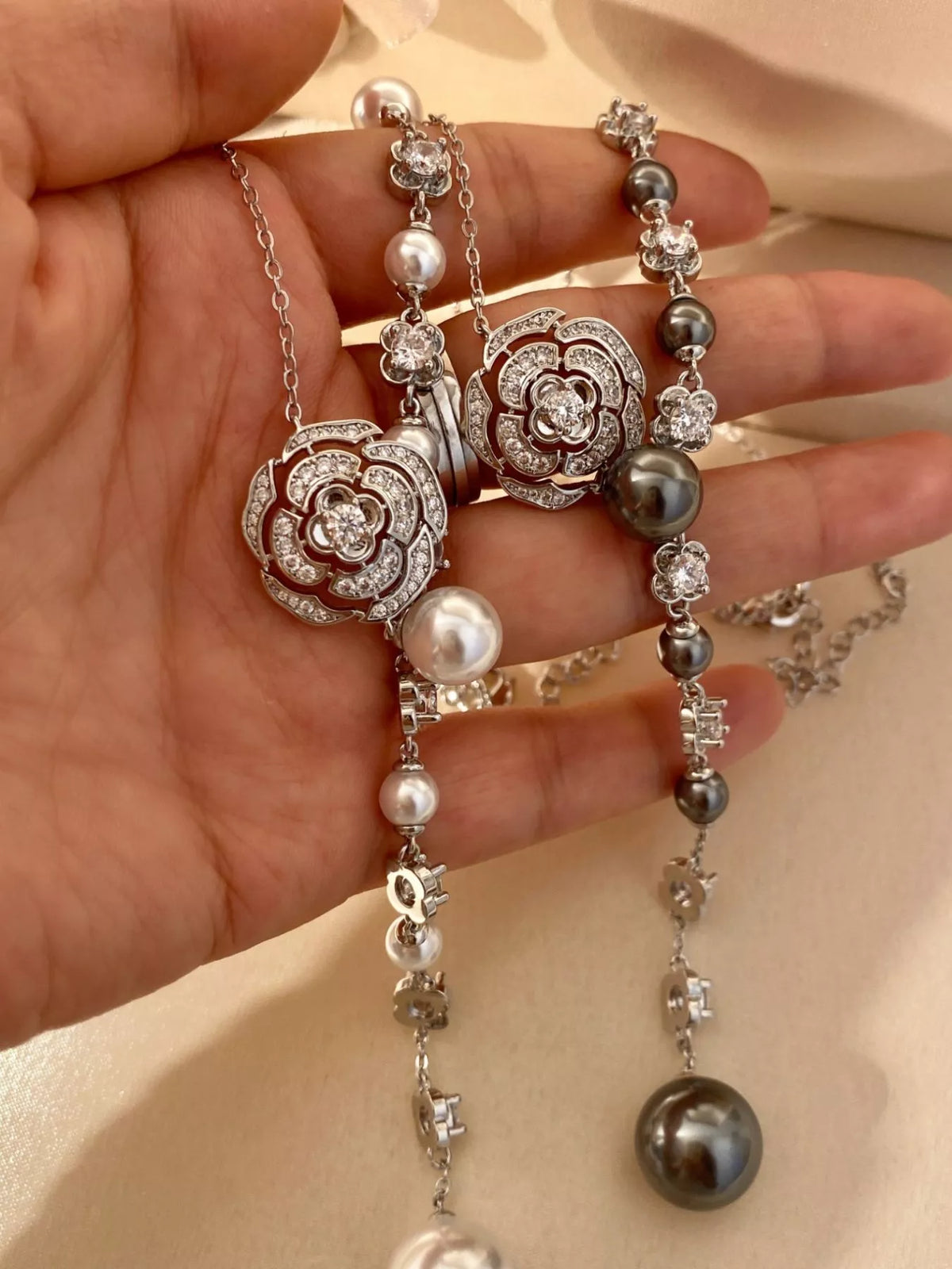 Pearl flower Y-necklace from Plush Fashion Hub featuring a delicate floral design and elegant pearl accents.
