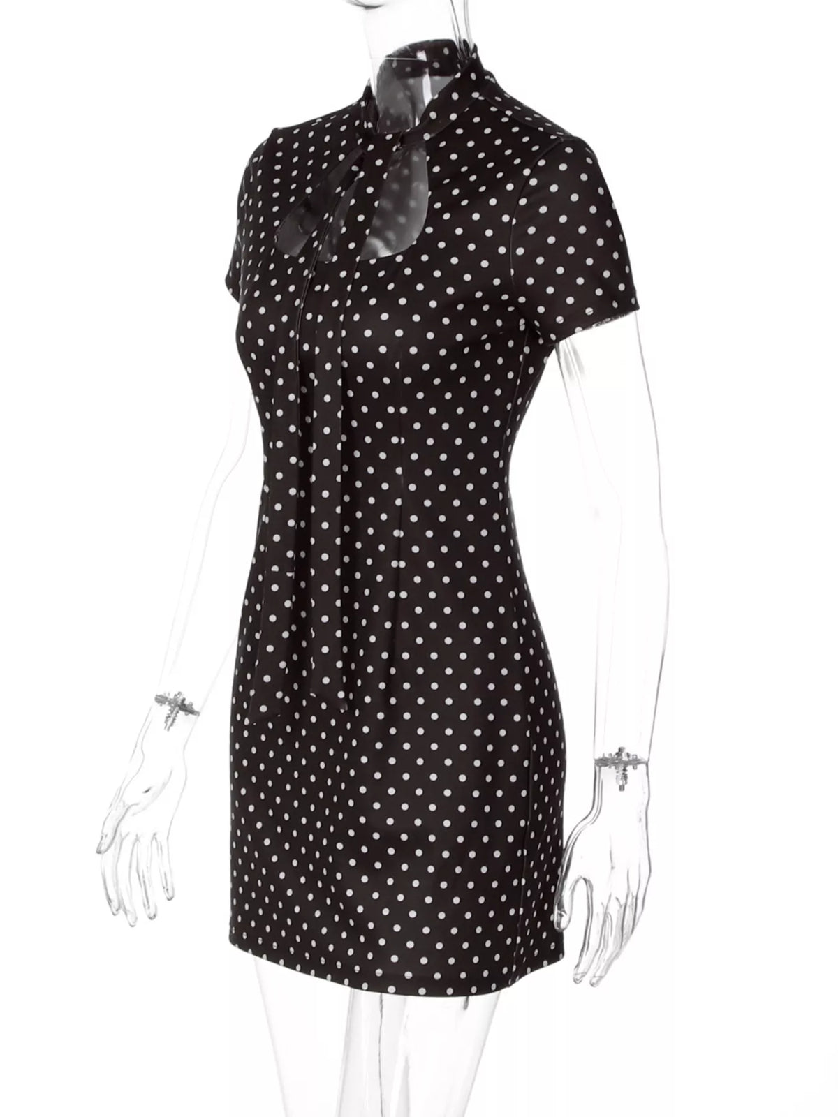 Polka dot cut-out front mini dress by Plush Fashion Hub featuring a stylish design and playful pattern.