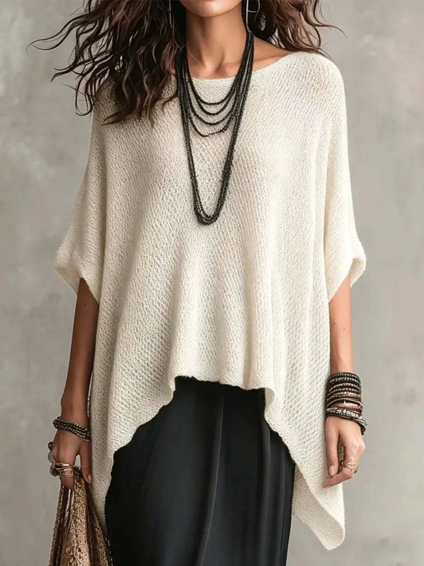 Plus size loose knit round neck top from Trendsi, featuring a cozy, full-size knit fabric and stylish round neckline.