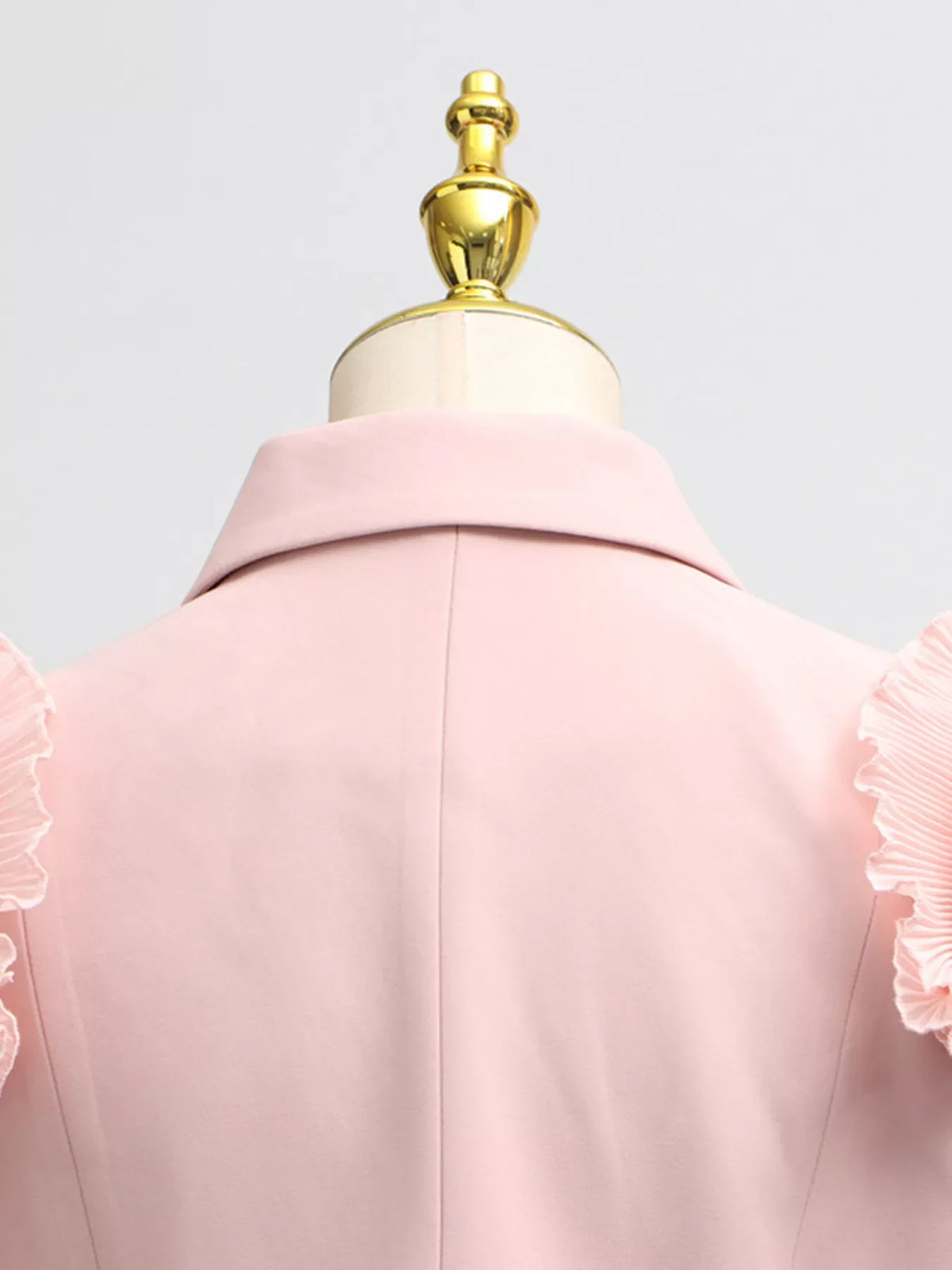 Plush Fashion Hub two-piece set featuring a frill lapel collar top and a matching pleated skirt, stylish and elegant ensemble.