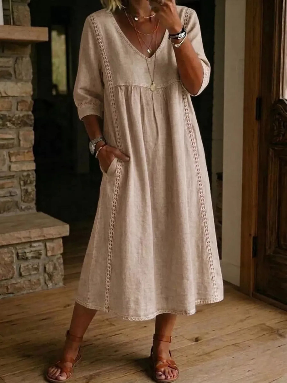 Plus size full-length v-neck midi dress with 3/4 sleeves by Trendsi, shown in a flattering, elegant design.