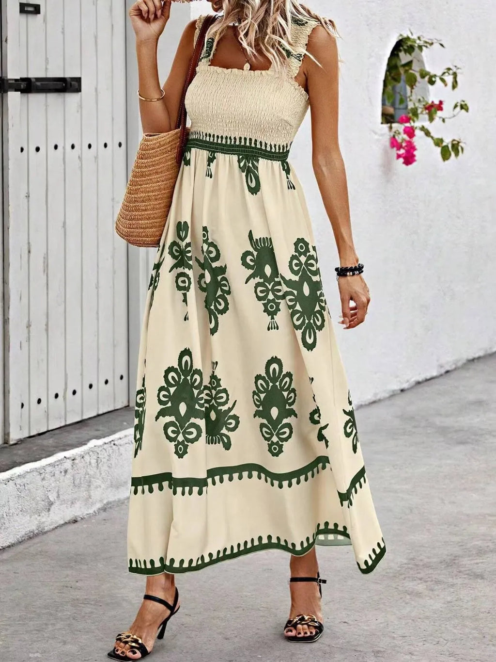 Smocked printed wide strap maxi dress by Plush Fashion Hub featuring a flowing silhouette and vibrant floral pattern.
