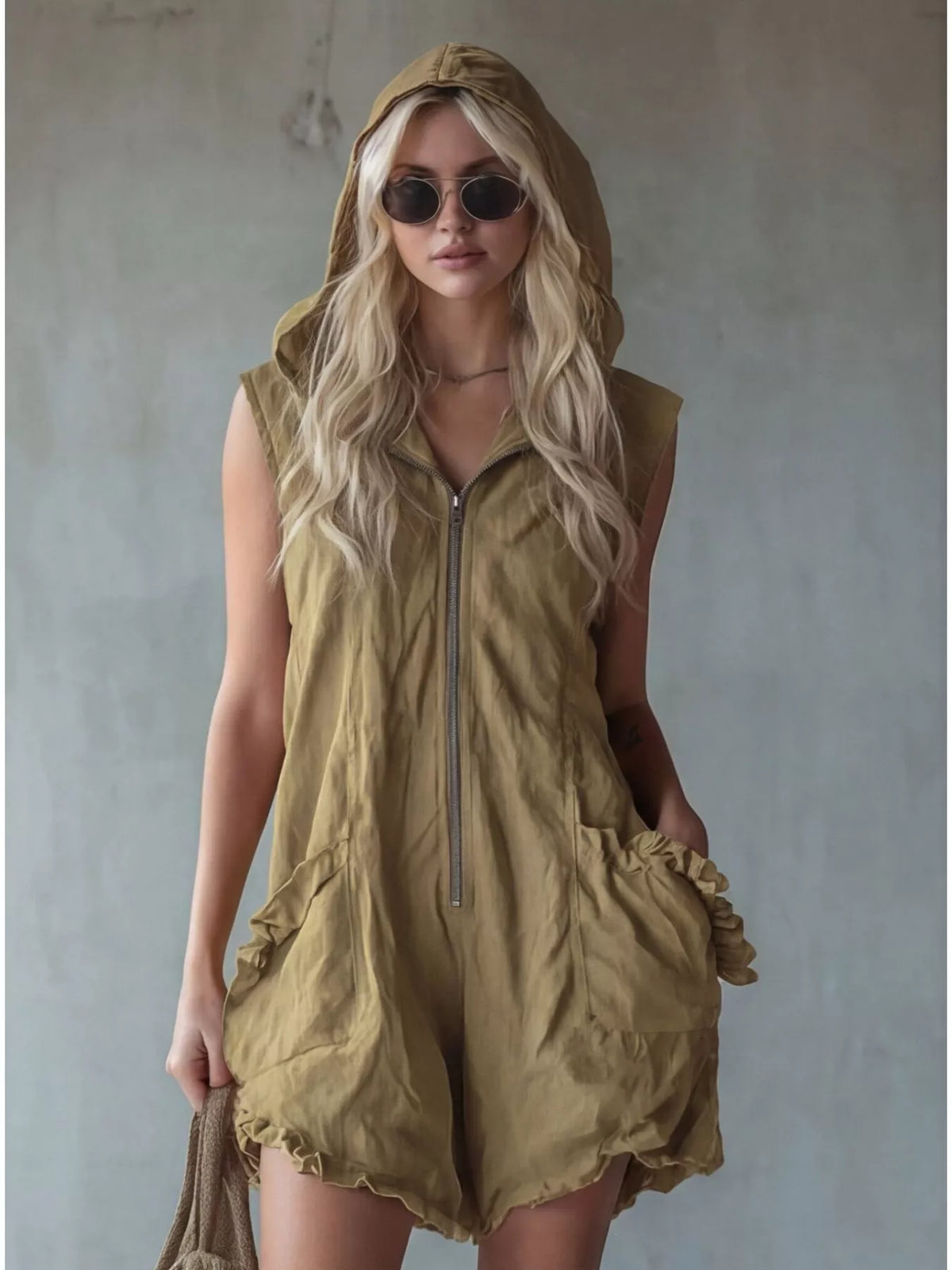 Plus size hooded sleeveless zipper romper by Plush Fashion Hub with ruffled pockets, full-length design and casual style.