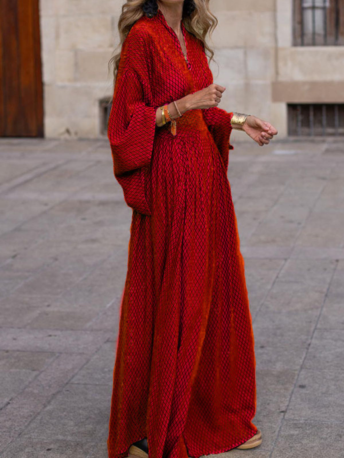 Elegant V-neck maxi dress with flowing sleeves from Trendsi, featuring a stylish and comfortable design for special occasions.
