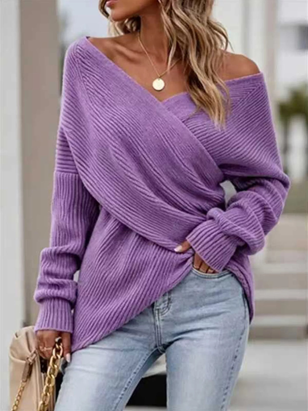 Crisscross ribbed knit long sleeve sweater in neutral tones, featuring a stylish design and fitted silhouette from Trendsi.
