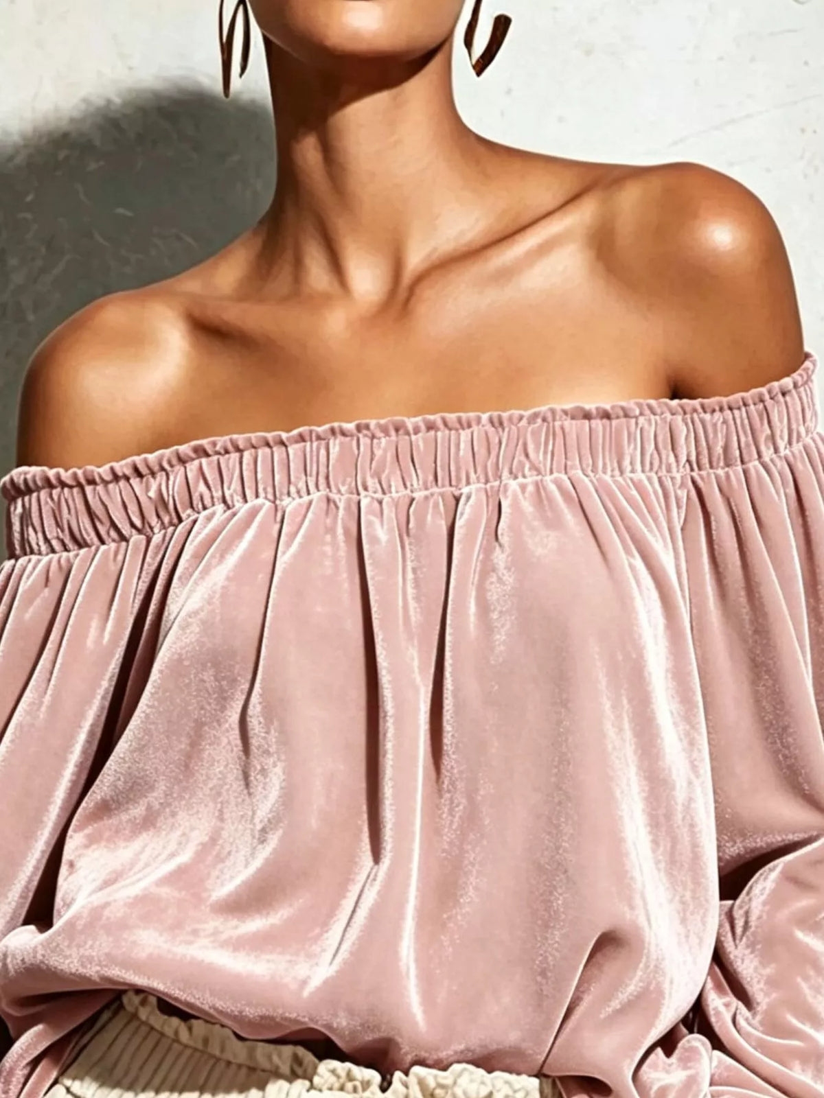 Off-shoulder velvet long sleeve T-shirt by Trendsi, featuring a stylish off-shoulder design and soft velvet fabric.