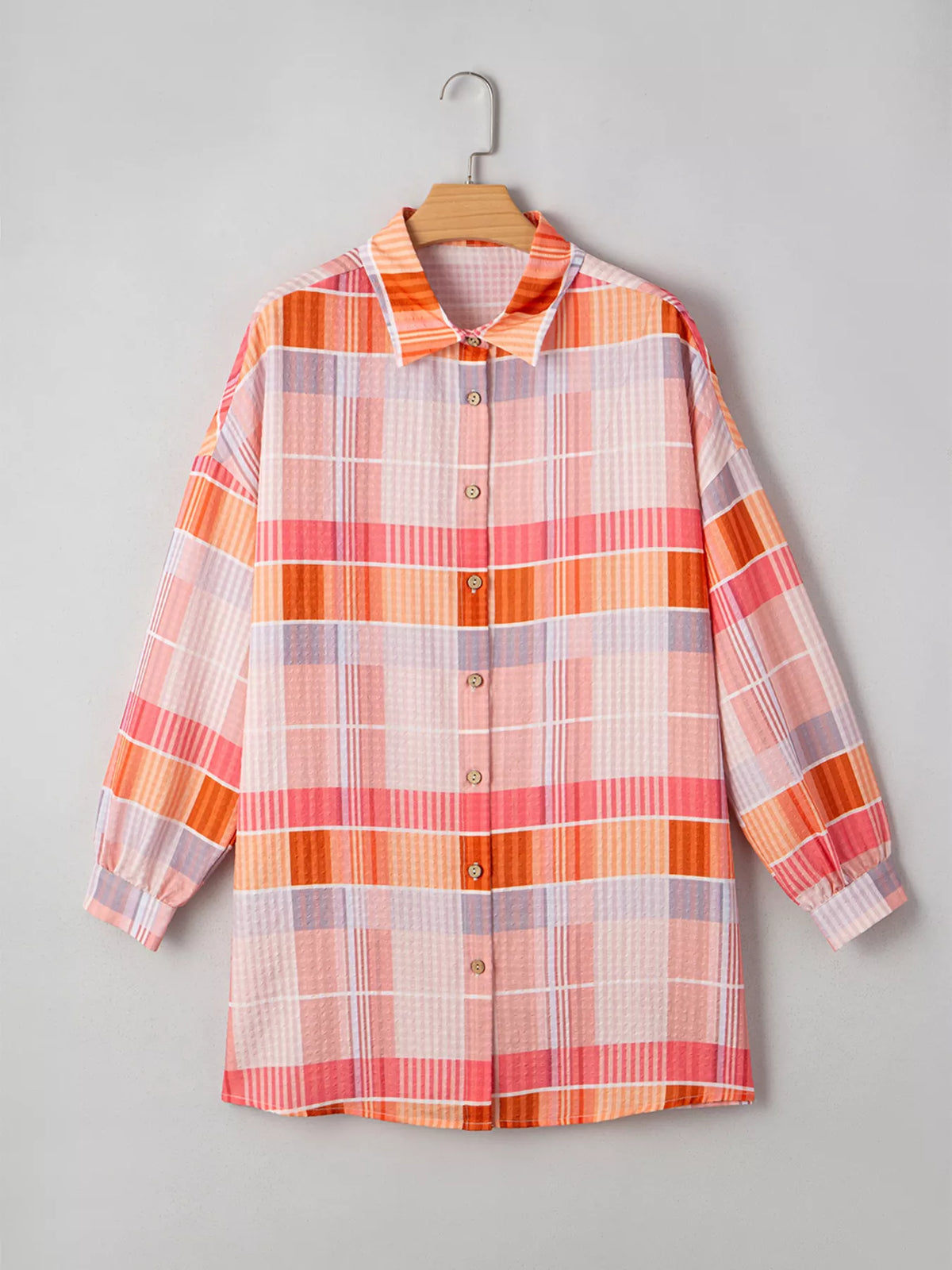 Oversized check tunic shirt for women by Trendsi, featuring a relaxed fit and classic plaid pattern, perfect for casual styling.