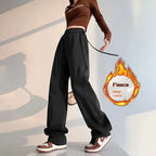 Gray high-waist loose wide-leg straight pants for women, casualwear style, shown on a model with hand in pocket.