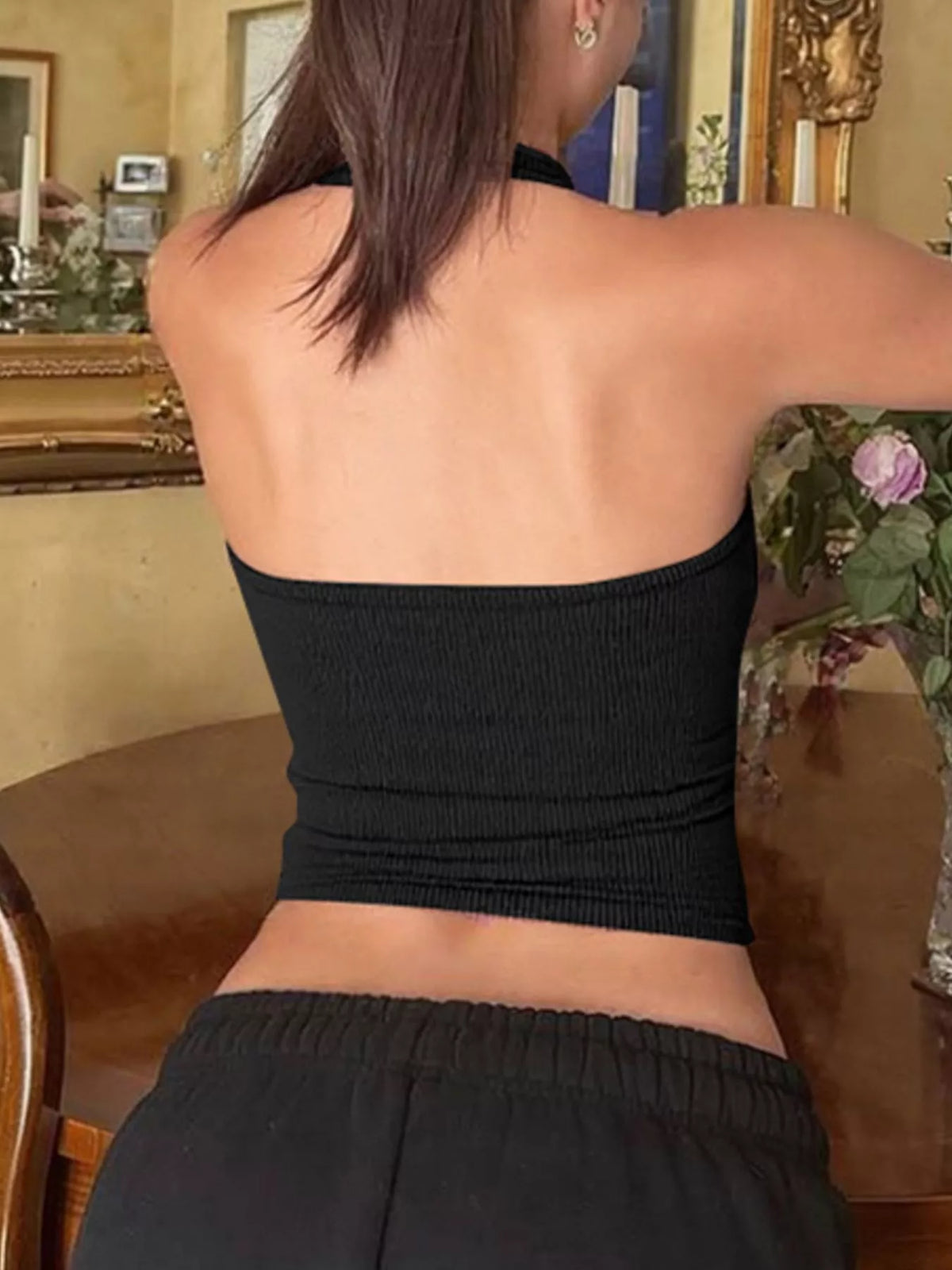 Ribbed halter neck tank top from Plush Fashion Hub, showcasing a snug fit and ribbed texture in a stylish design.