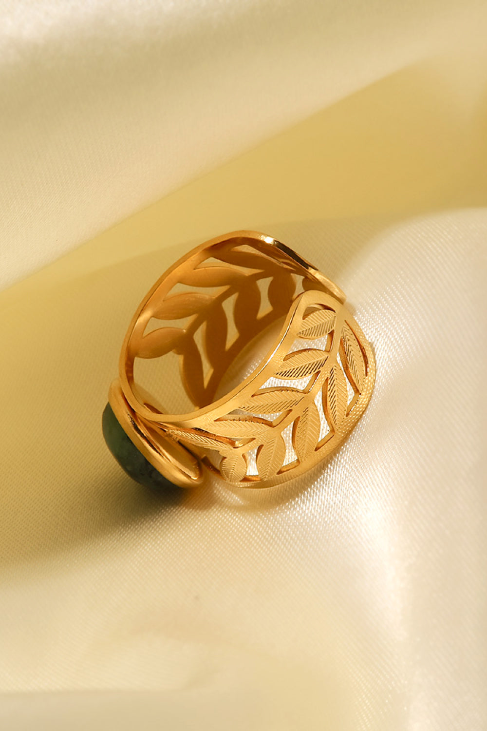 18k gold plated malachite leaf ring featuring a detailed green gemstone design on a delicate gold band.