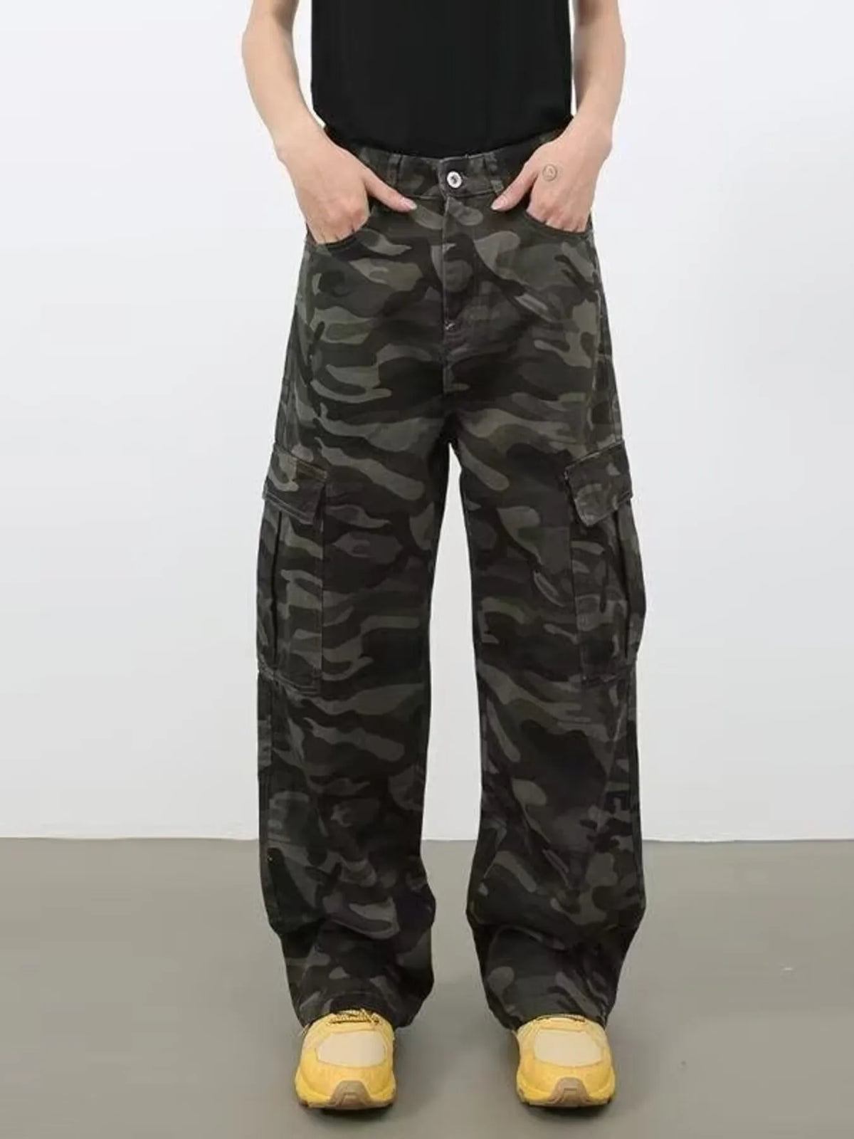 Men's full size camo print wide leg cargo jeans by Plush Fashion Hub, showcasing durable fabric and stylish camouflage design.