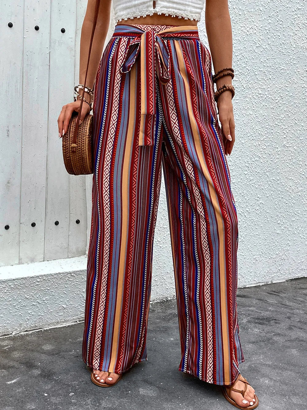 Plush Fashion Hub geometric tied wide-leg pants featuring a bold geometric pattern and relaxed fit, displayed on a model.