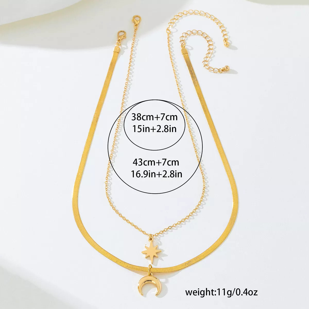 18K gold-plated moon and star necklace set featuring delicate pendant designs, perfect for elegant jewelry styling.