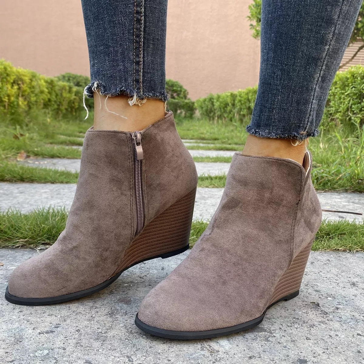 Round toe wedge ankle boots from Trendsi featuring a stylish design, ankle height, and comfortable wedge heel.