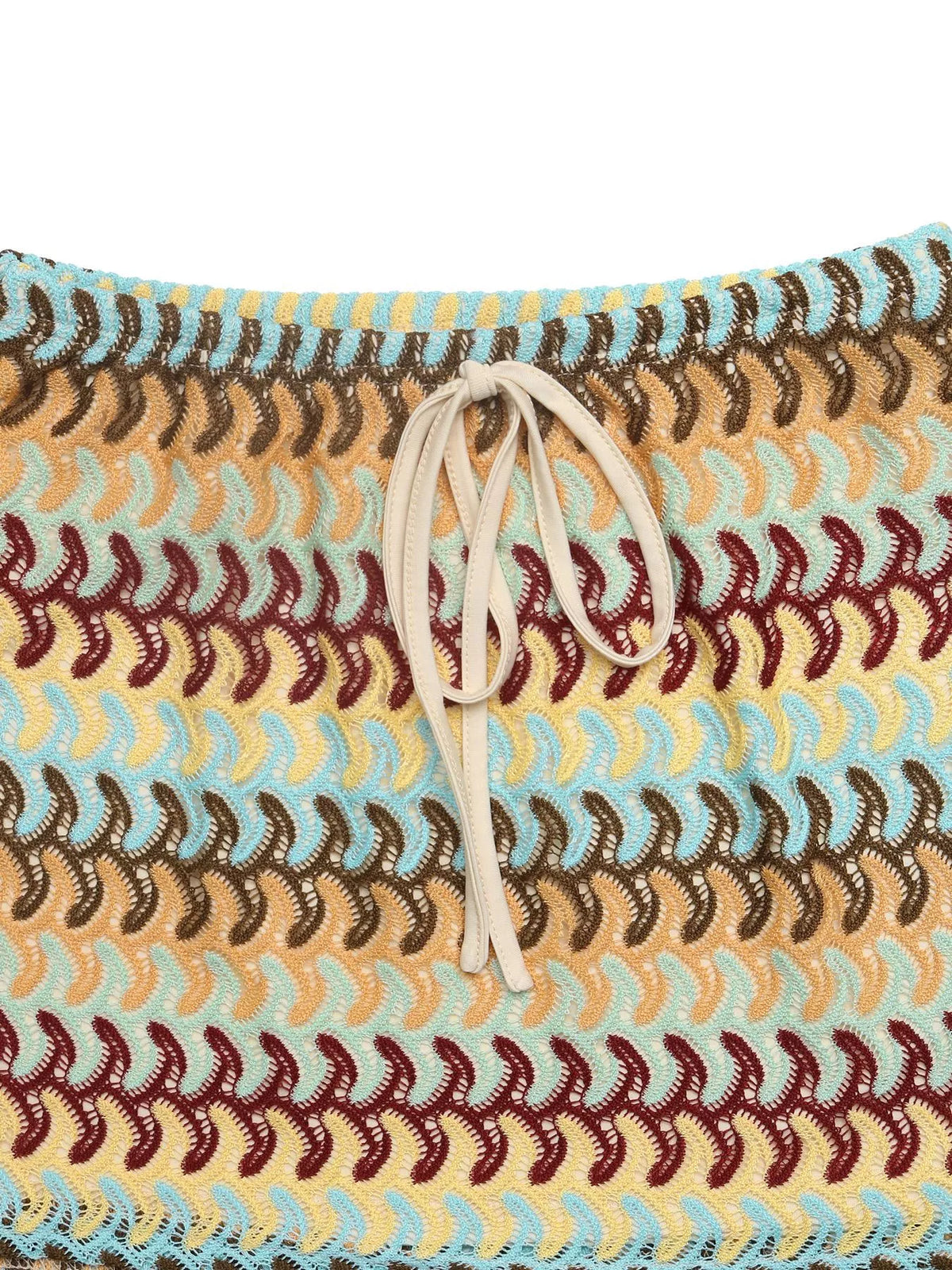 Crochet drawstring mini skirt from Plush Fashion Hub showing intricate crochet pattern and adjustable waist tie.