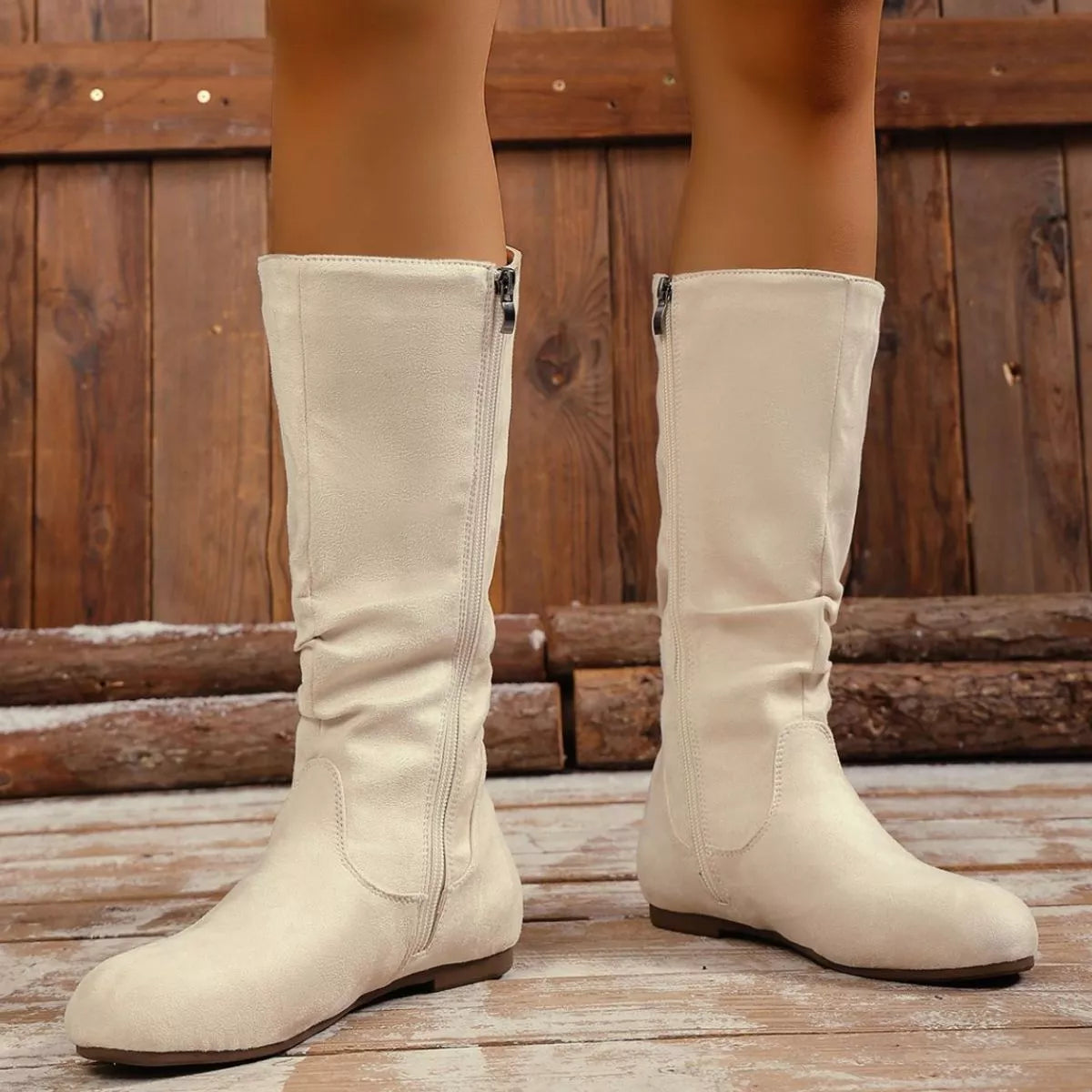 Trendsi round toe side zip boots showing black leather material, ankle height, and sleek design with side zipper closure.