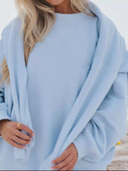 Relaxed fit round neck sweatshirt and shorts set by Trendsi, featuring a comfortable casual 2-piece outfit in soft fabric.