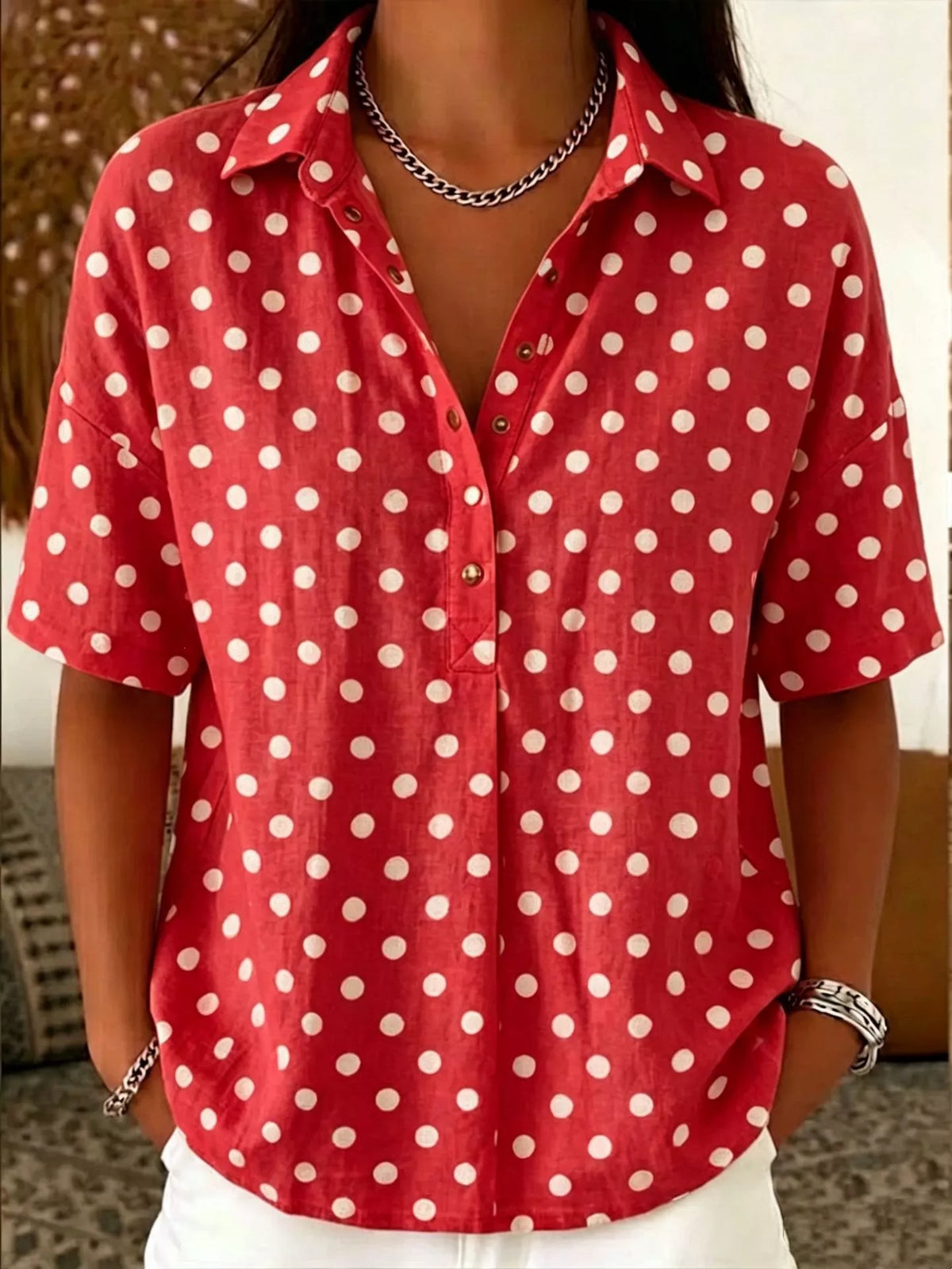 Plus size polka dot short sleeve shirt from Trendsi, stylish full-size top with a classic polka dot pattern and comfortable fit.