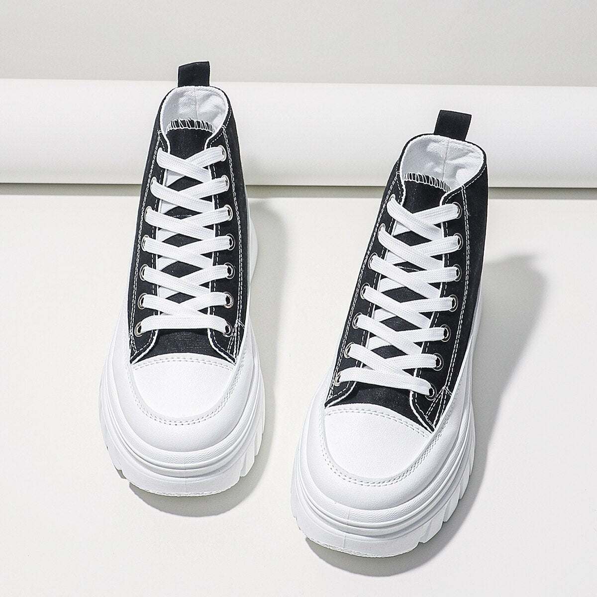 Women Lace-Up Front High Top Platform Canvas ShoesThese women's canvas shoes feature a stylish lace-up front and a high top platform design. With a flat heel, they offer both comfort and height. The height increasinShoePlush Fashion ShopPlush Fashion Shop