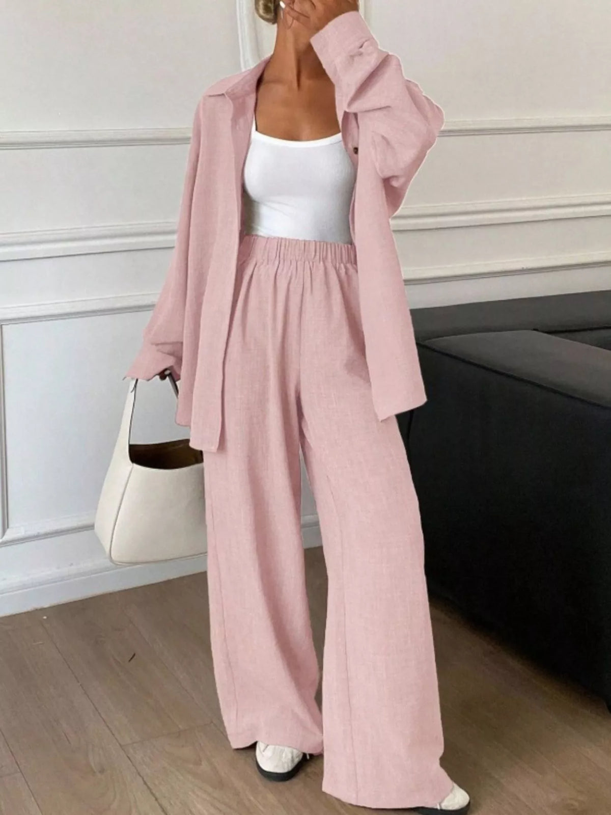 Trendsi long sleeve button-up shirt and wide-leg pants set, featuring a stylish, coordinated outfit with a sleek, modern fit.