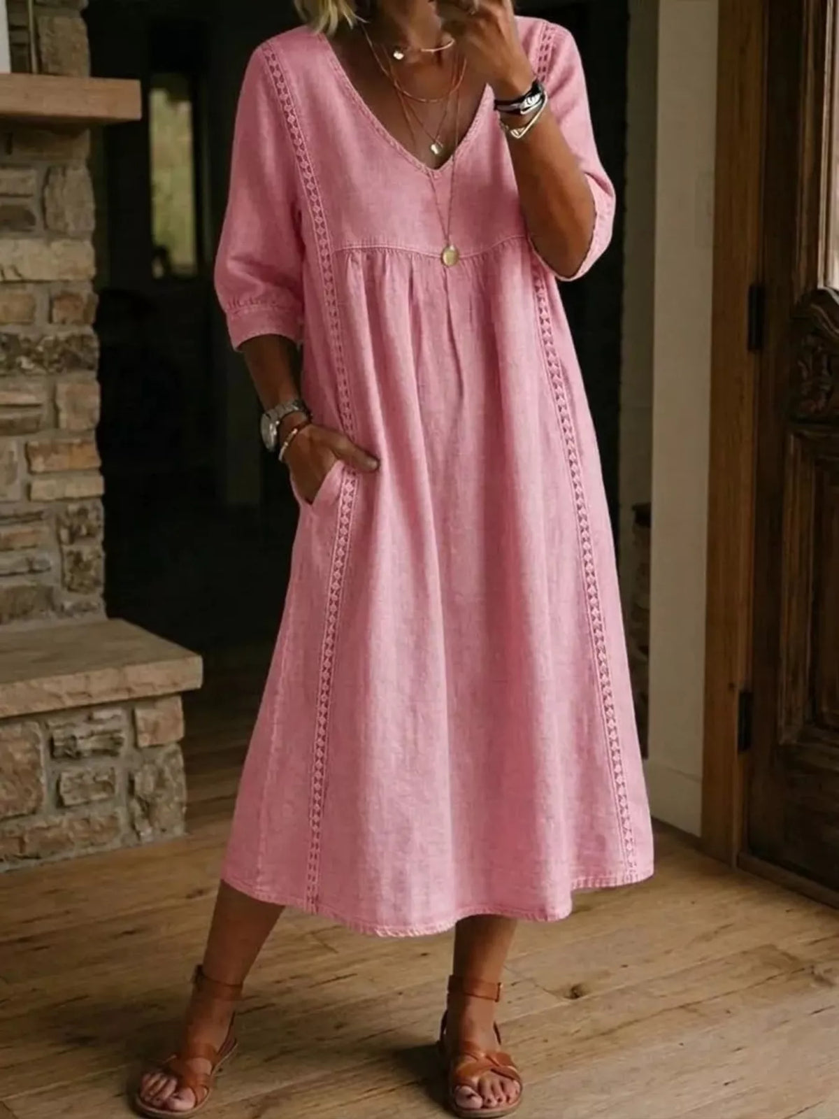 Plus size full-length midi dress with V-neck and 3/4 sleeves from Trendsi, featuring a stylish, comfortable fit.
