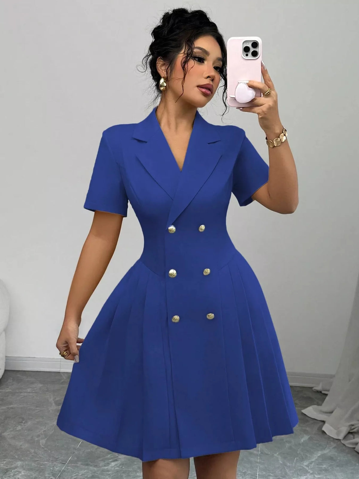 Plush Fashion Hub double-breasted pleated blazer dress featuring structured design and stylish lapels on a mannequin.