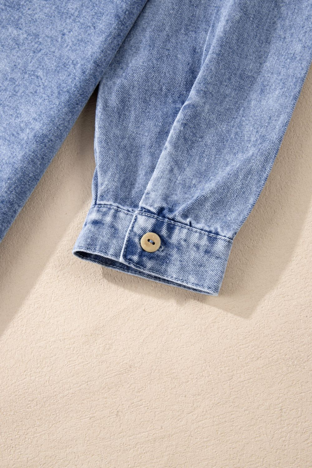 Raw hem button-down long sleeve denim dress by Plush Fashion Hub, shown in a stylish casual look with a classic blue denim fabric.