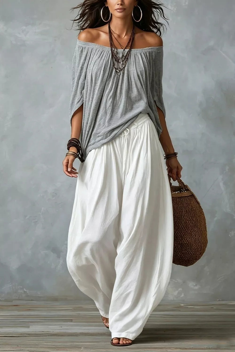 Plus size off-shoulder top and wide-leg pants matching set by Trendsi, featuring flowing fabric and stylish fit.