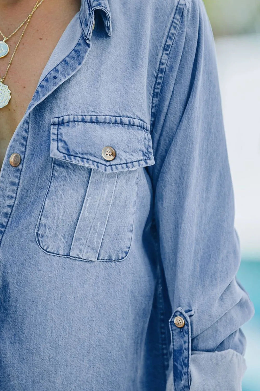 Denim top with long sleeves, collared neck, and pockets, styled with denim jeans from Trendsi