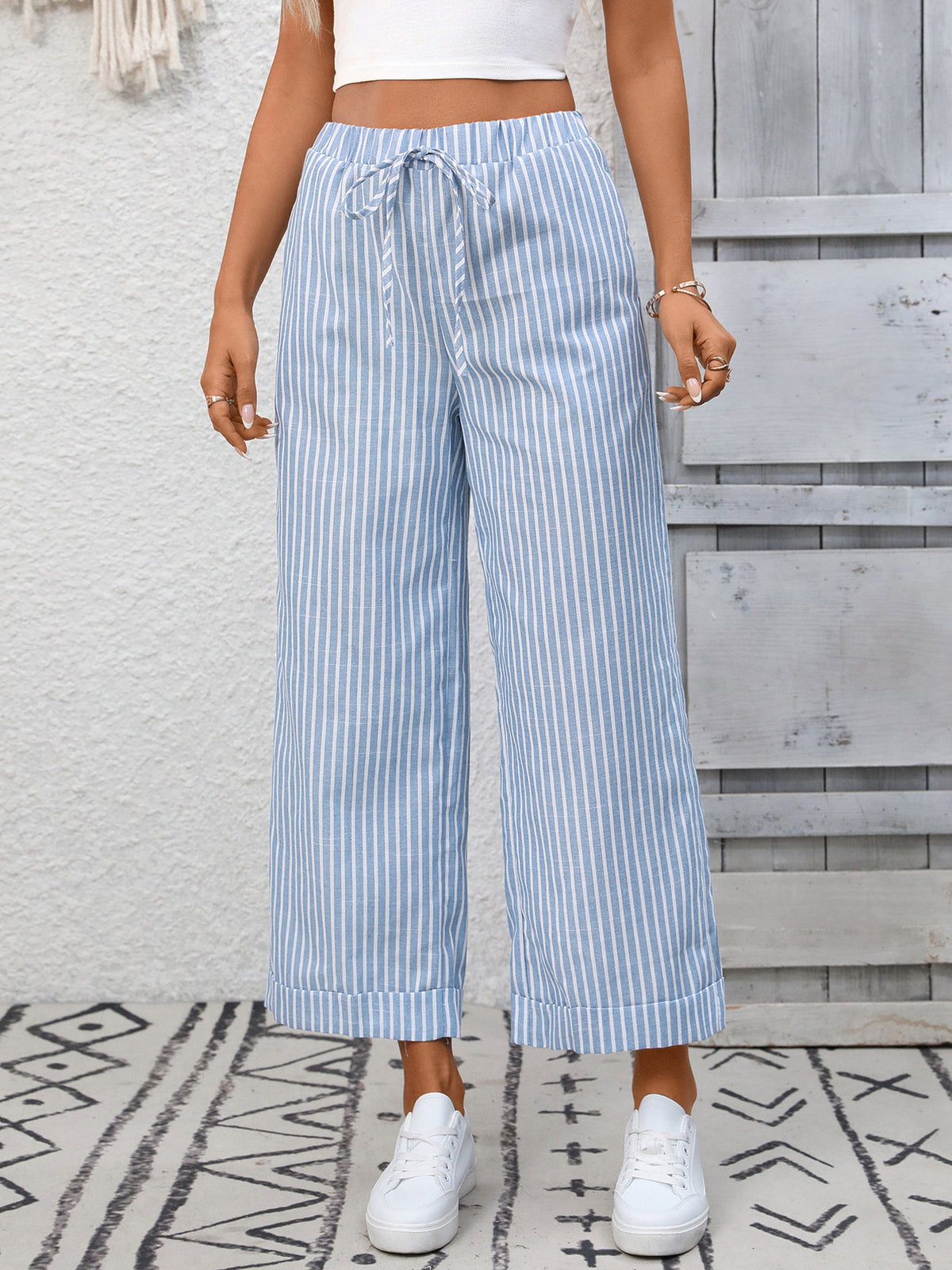 Women’s striped wide-leg drawstring pants with pockets by Plush Fashion Hub, showing the relaxed fit and stylish design.