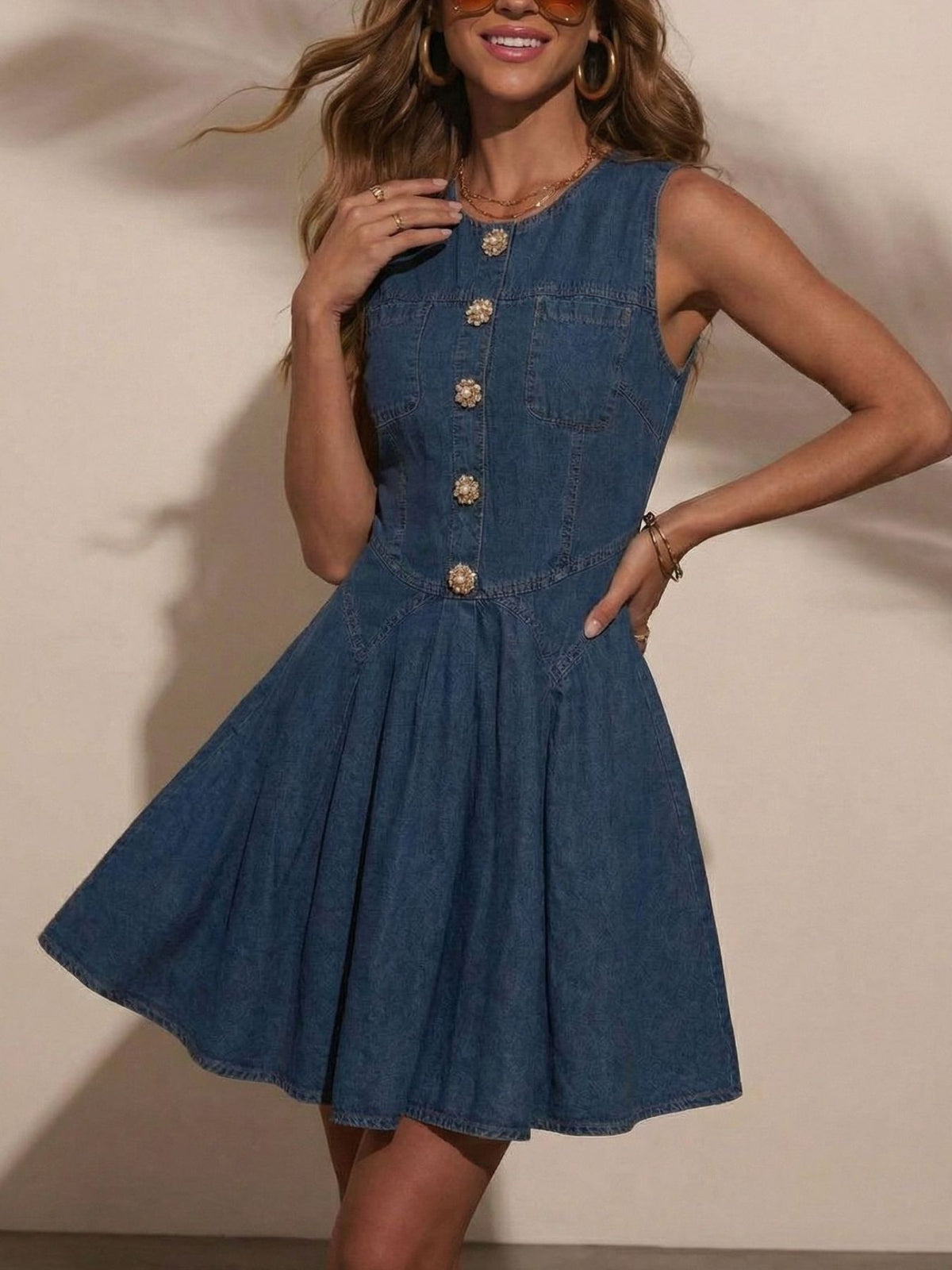 Women's sleeveless denim mini dress by Plush Fashion Hub featuring a button front and stretchy cotton blend fabric.