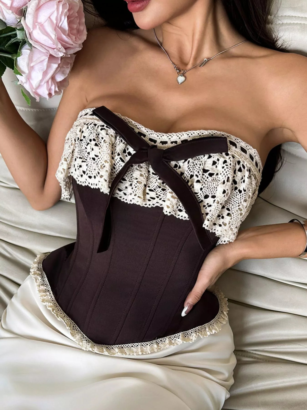 Crochet lace strapless boned corset with lace-up waist cincher and tube top design, featuring intricate lace details and structured fit.
