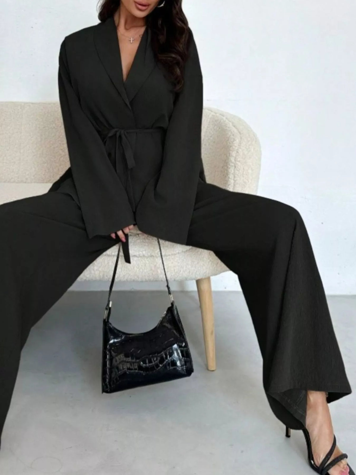 Textured tie waist top and wide-leg pants set for women by Trendsi, featuring a stylish, comfortable matching fashion ensemble.