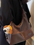 Vintage-inspired PU leather slouchy hobo shoulder bag with a relaxed design, trendy and spacious for everyday use.