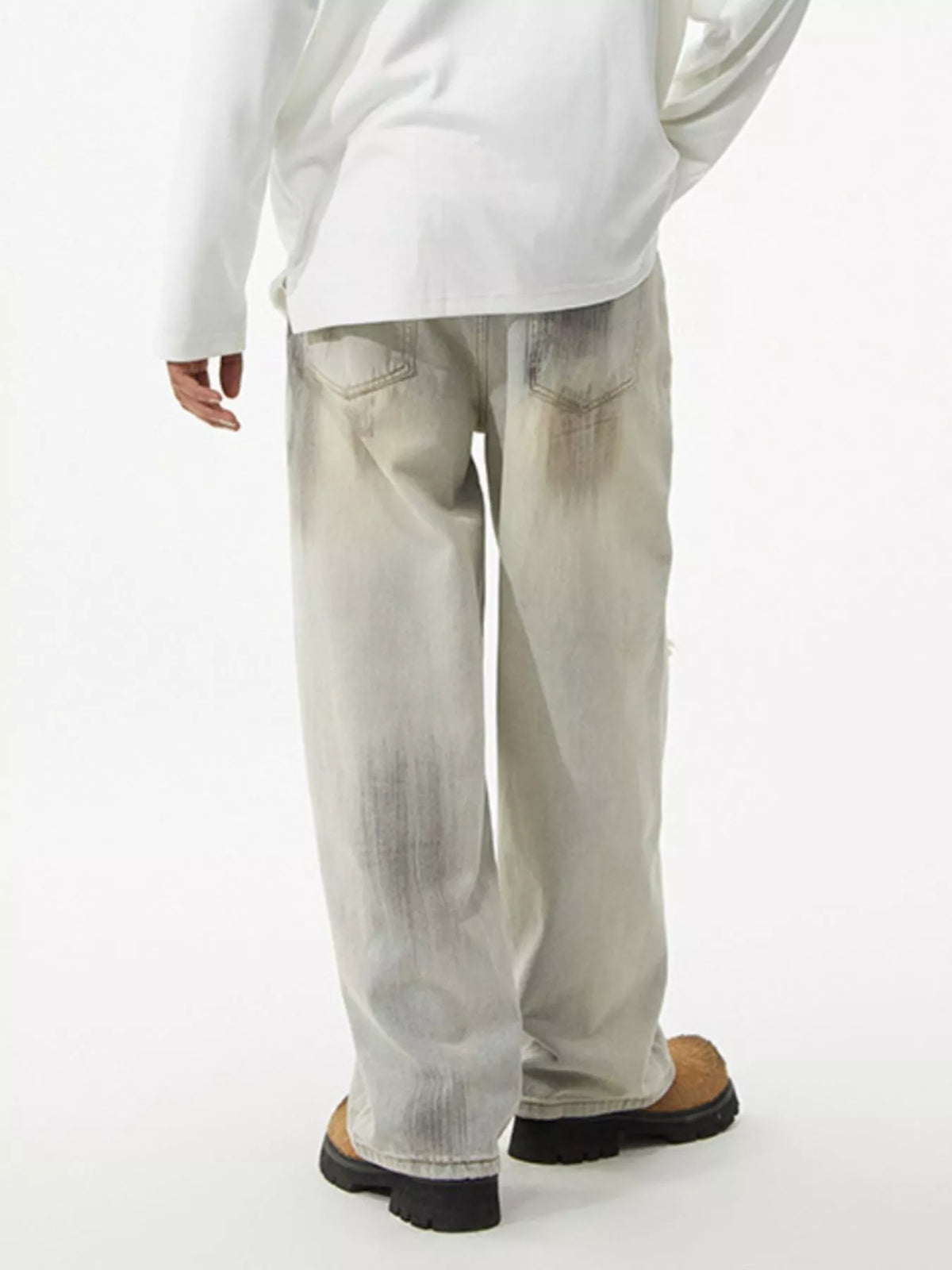 Men's distressed wide leg jeans by Plush Fashion Hub featuring ripped details and relaxed fit, displayed on a neutral background.