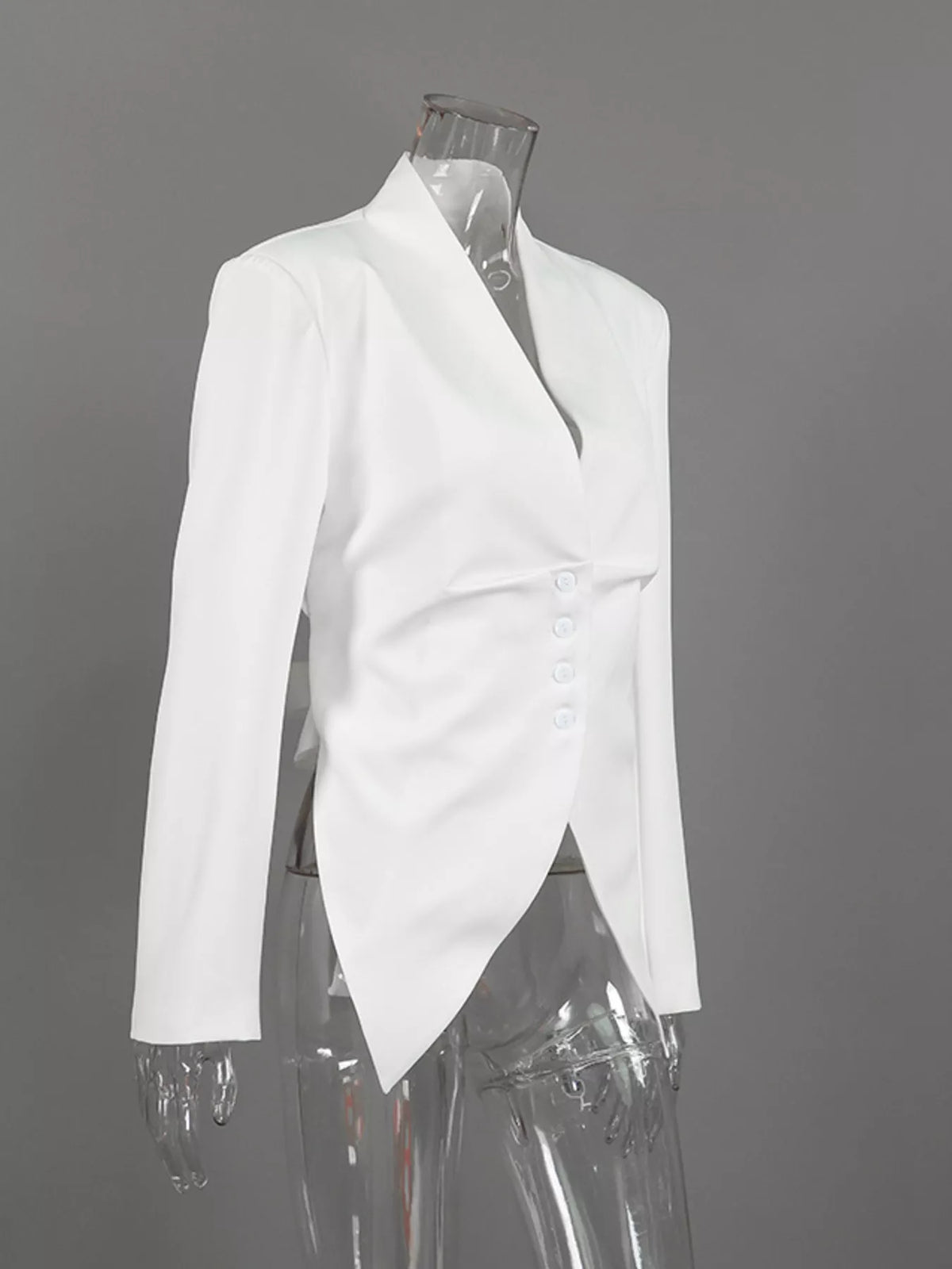 Slim-fit asymmetric hem blazer by Trendsi, featuring tailored design and modern style, shown on a model with a neutral background.