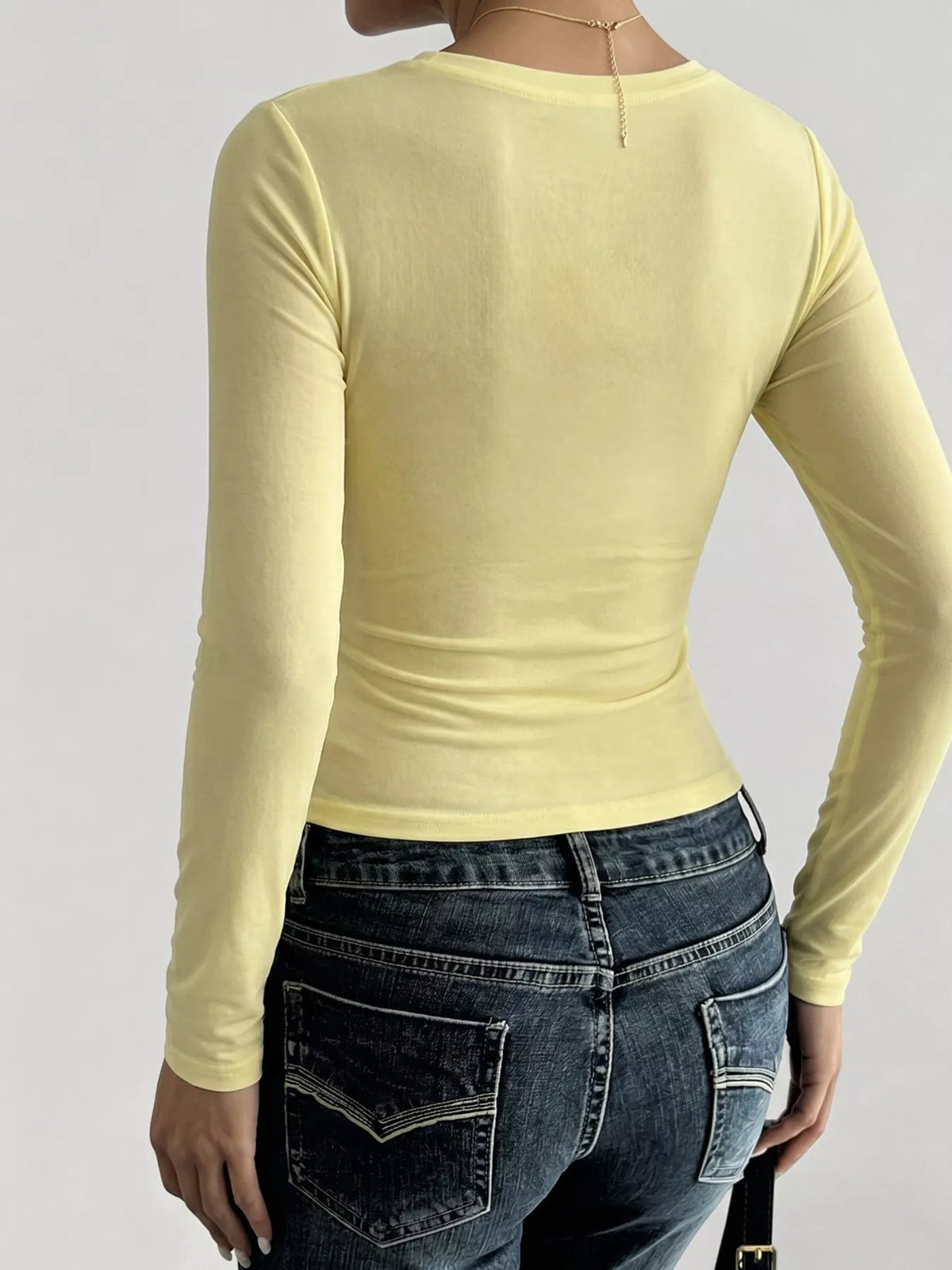 Women's slim fit long sleeve shirt by Trendsi, soft fabric, fitted design, in a neutral color, perfect for casual or layered outfits.