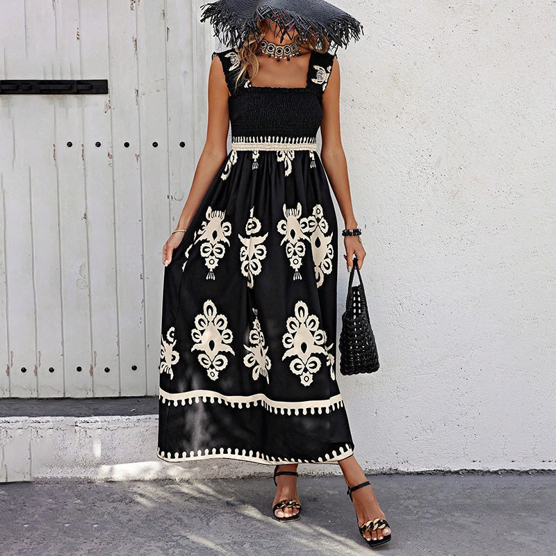 Women’s wide-strap printed maxi dress by FitiqueFit, casualwear with vibrant floral pattern and flowing fabric, full-length view.