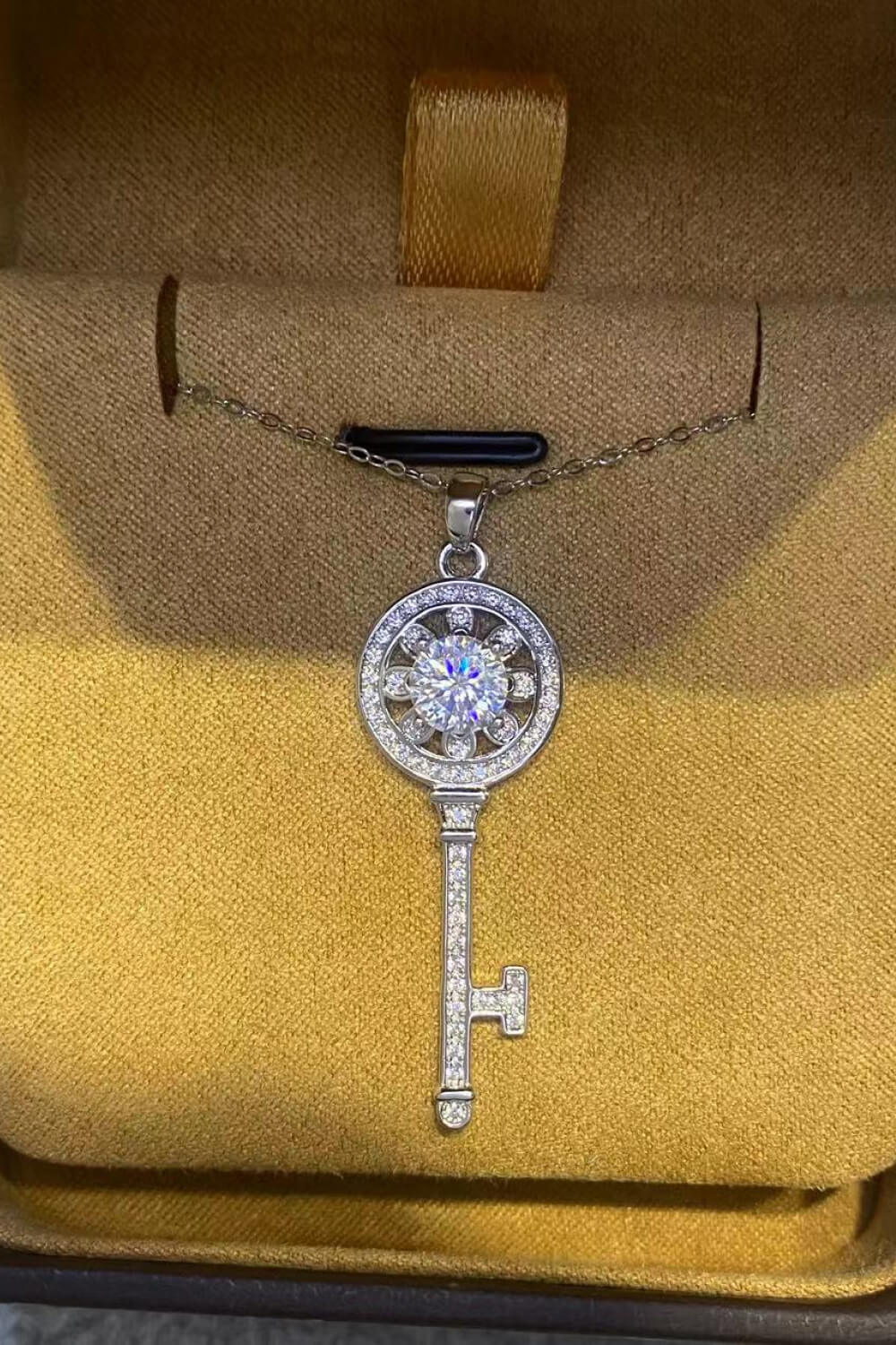 Platinum plated key pendant necklace with 1 carat moissanite gemstone, elegant jewelry piece from Plush Fashion Hub.
