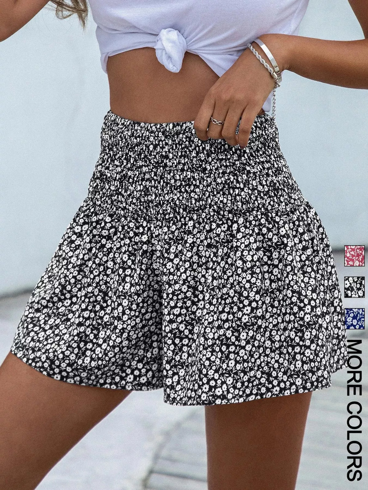 Floral print elastic waist shorts by Plush Fashion Hub featuring vibrant flower patterns and comfortable fit.