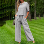 FitiqueFit casual two-piece set with round-neck 3/4 sleeve top and matching pants in various colors, available in sizes S to XXL.