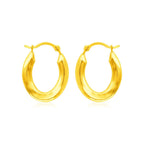 14k yellow gold polished oval hoop earrings with smooth, shiny surface and classic hoop design.