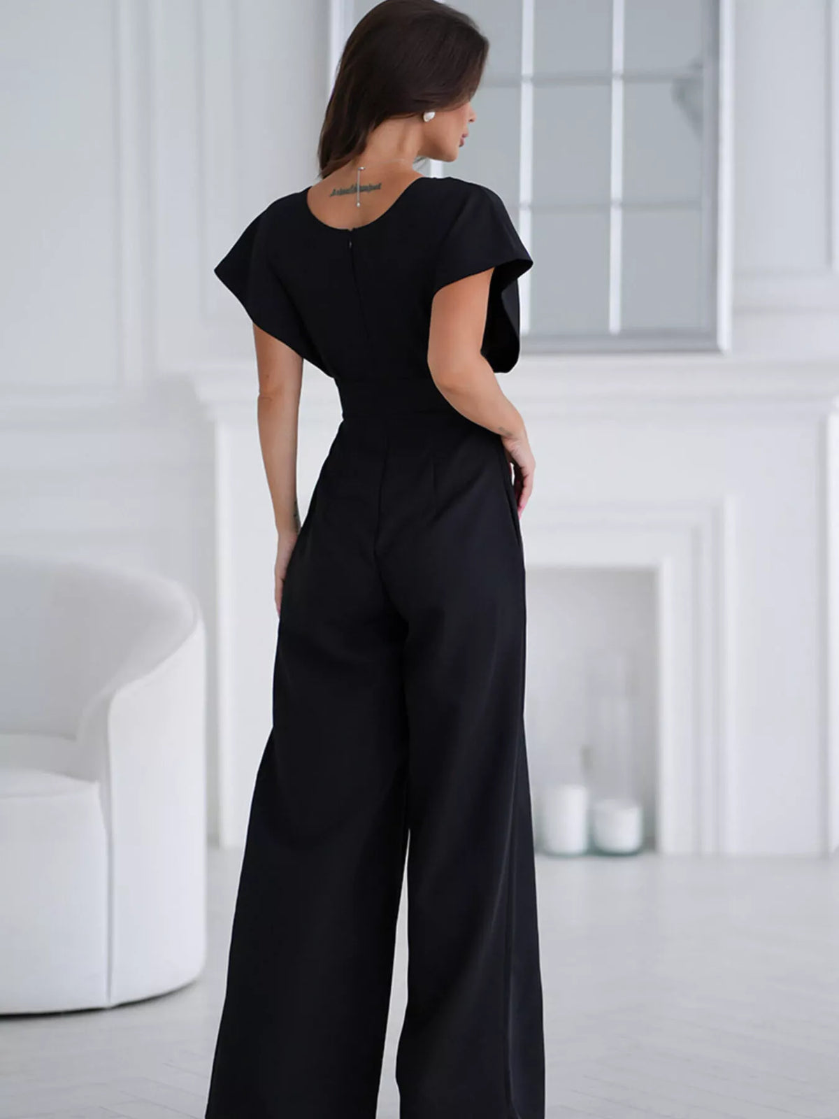 Plush Fashion Hub plush white surplice wide-leg jumpsuit with long sleeves, stylish and comfortable for casual wear.