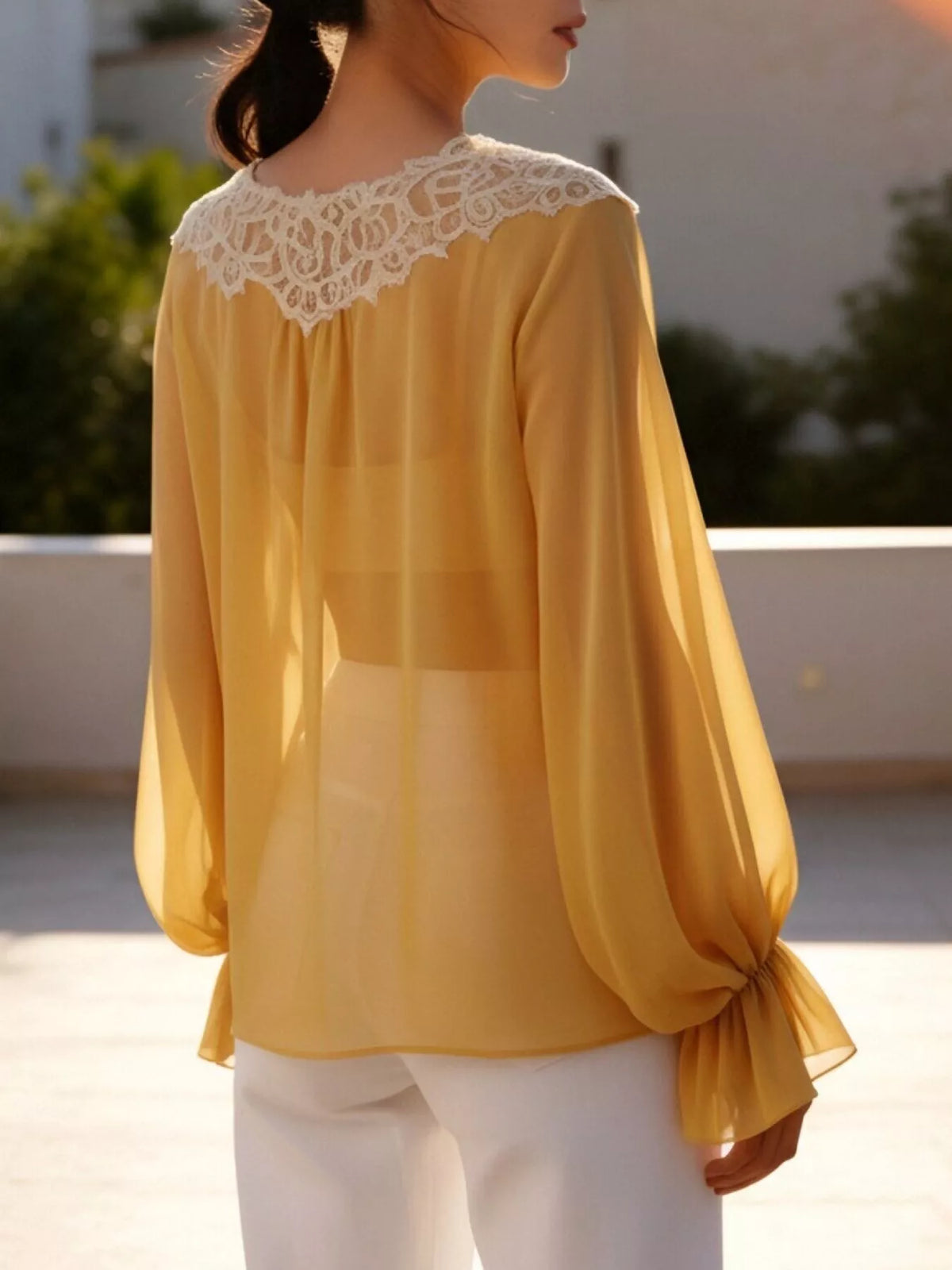 Sheer lace-trimmed front tie blouse for women, featuring delicate lace details and a stylish front knot design.