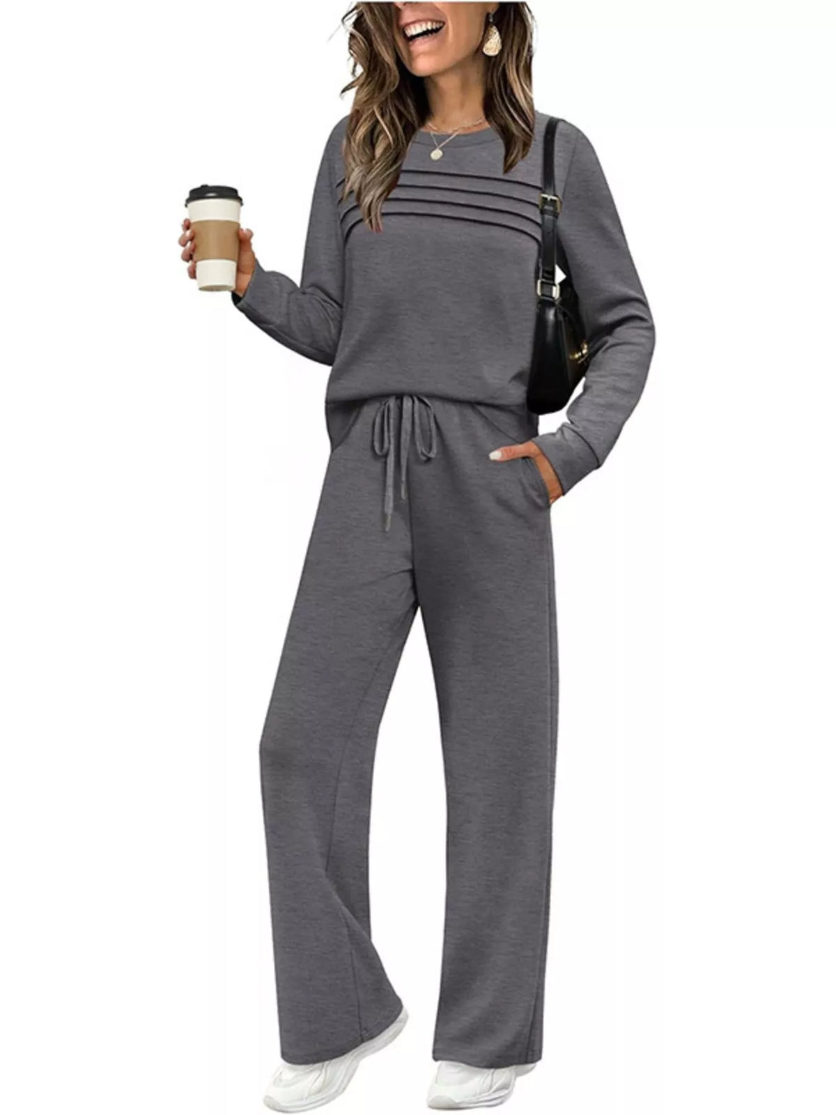Plus size casual long sleeve crewneck top and drawstring pants matching set by Trendsi, shown in a comfortable, relaxed fit.